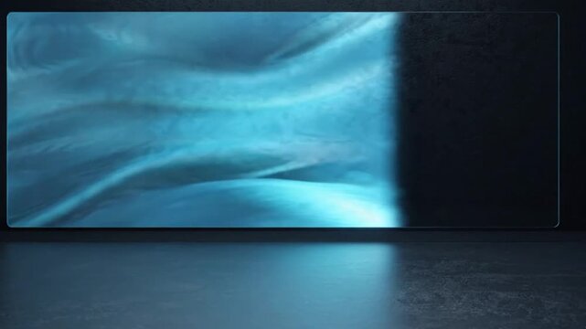 Glowing blue wave energy flowing across a sleek wide screen monitor in a dark minimalist studio environment video footage clip