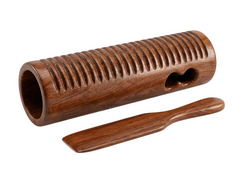 Traditional wooden guiro percussion musical instrument with a stick for playing