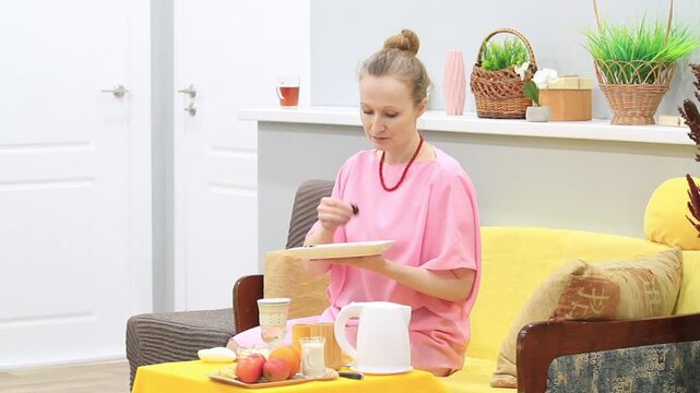 woman tasting dried ginkgo biloba leaves to brew herbal tea, side view