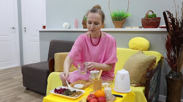 woman eating in kitchen
