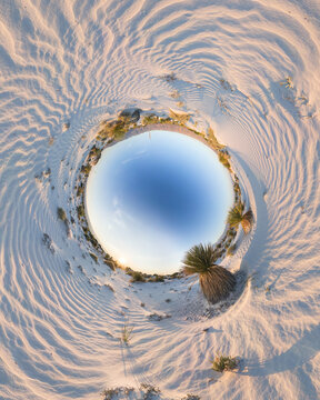 View of Los Arenales gypsum dunes in a spherical panorama with desert vegetation and clear blue sky in Cuatrocienegas, Coahuila, Mexico.