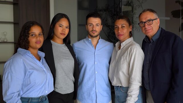 Multiracial business people looking serious on camera inside modern office - Start up, real estate and multi generational entrepreneurs concept