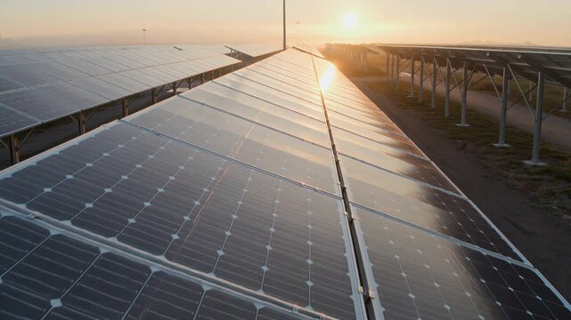 Solar panels generating renewable energy at sunrise