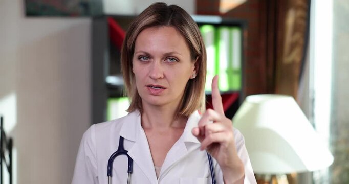 A dedicated doctor shares insightful health advice with a warm smile in her inviting clinic. The atmosphere feels friendly and encouraging while she gestures to emphasize key points.