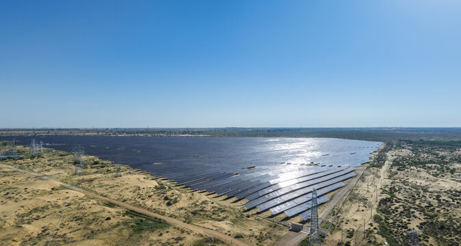 Aerial View of Massive Desert Solar Power Plant Under Clear Blue Sky