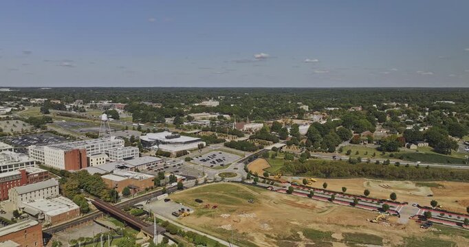 Winston-Salem North Carolina Aerial v20 flyover above paths and trails along Research Parkway toward the downtown skyline - Shot with Mavic 3 Pro Cine - Oct 1st 2023