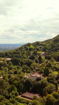 Overhead 60FPS vertical social ratio aerial video of Belfast Zoo and Cavehill in North Belfast, Northern Ireland in the UK on a bright sunny day. Produced with Rec709 colour.