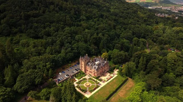 Rising 4K 60FPS aerial video of Belfast Castle and Cavehill in North Belfast, Northern Ireland in the UK on a bright sunny day. Produced with Rec709 colour.