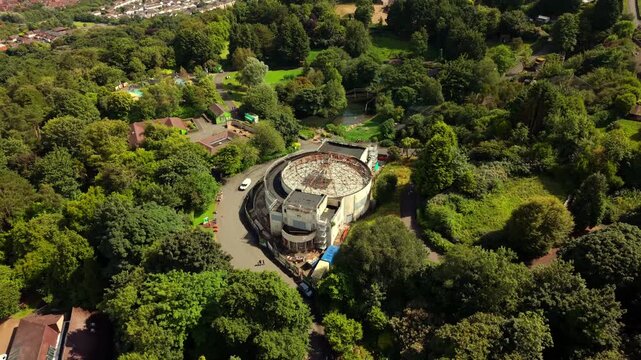 Rising 4K 60FPS aerial video of Belfast Zoo and Cavehill in North Belfast, Northern Ireland in the UK on a bright sunny day. Produced with Rec709 colour.