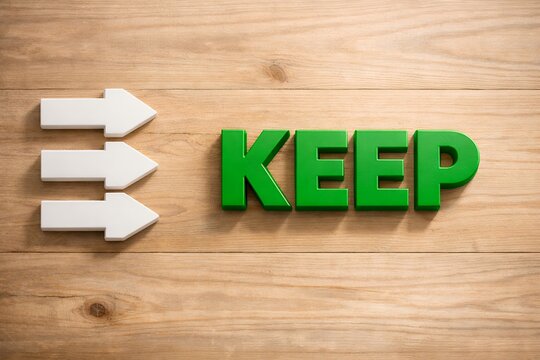 緑色の「KEEP」と木目背景を指し示す白い矢印の継続