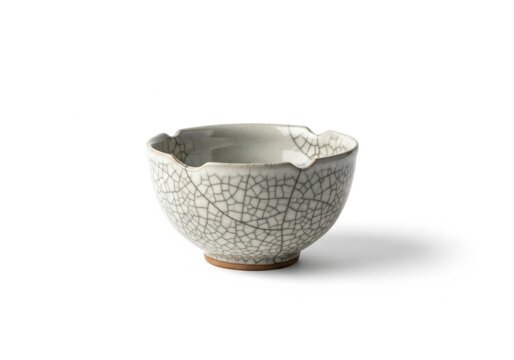 Traditional ceramic tea bowl with crackle glaze isolated on white