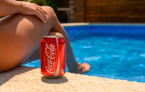 Anapa, Russia - July 14, 2025: Coca-Cola with a relaxing girl at the hotel pool. Refreshing drink