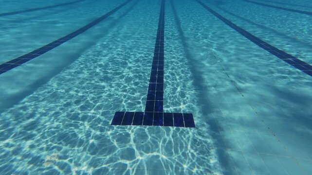 Underwater View of Swimming Pool Floor Markings and Ripples