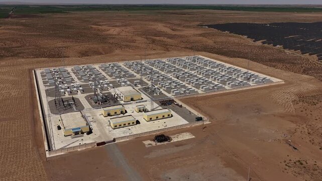 Aerial View of Utility-Scale Battery Energy Storage System and Substation in Arid Northwest China Desert