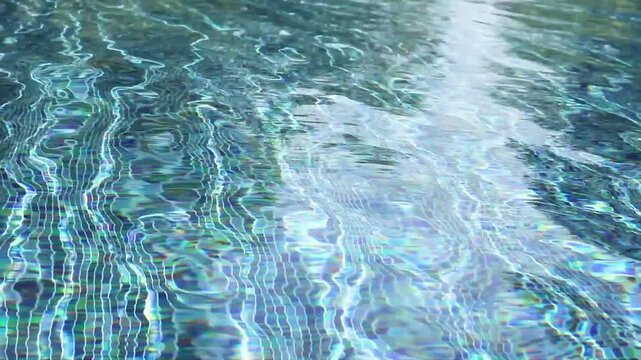 Swimming pool with blue crystal clear water surface and ripple wave background