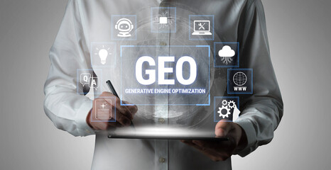 Obraz premium Person in formal attire holding digital tablet with generative engine optimization interface and colorful icons representing technology and data analysis. Fluxor.