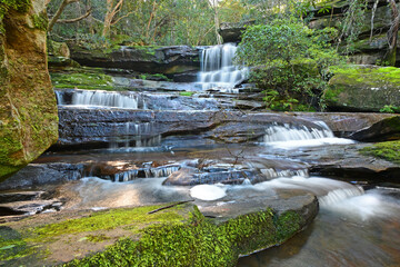 Waterfall cascading over rocks © Douglas Cliff