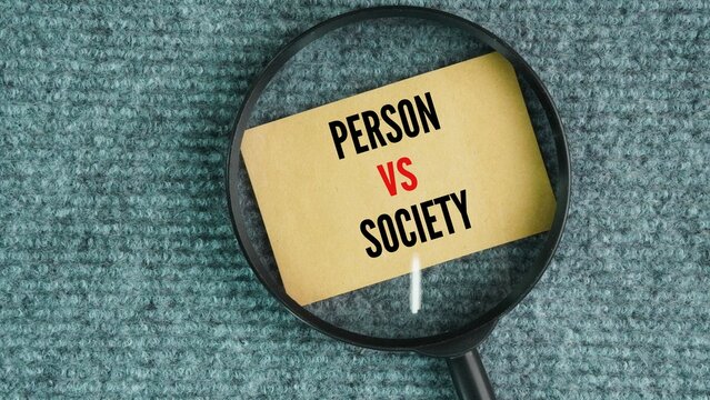 A magnifying glass and paper with the words Person vs. Society. It happens when a main character fights against unfair laws, bad rules, or the normal beliefs of a community.