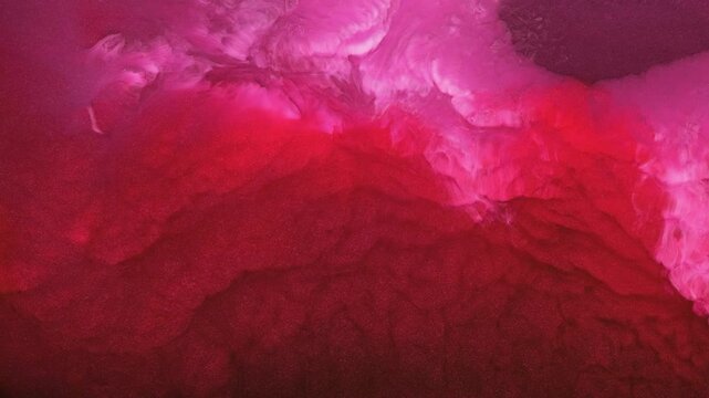 Mixing different colored alcohol inks in an art studio during the day