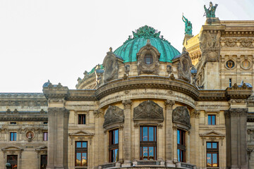Fototapeta premium Palais Garnier architecture details in Paris, France, featuring the iconic green dome and intricate facade of the opera house