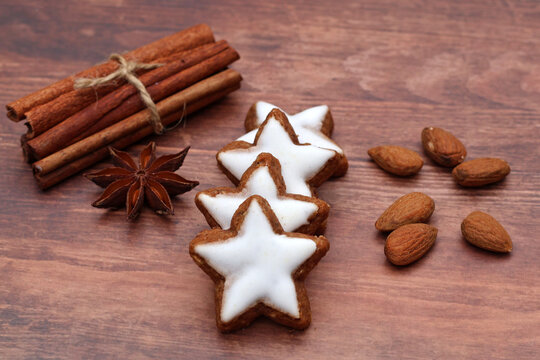 Traditional Christmas pastries &ndash; cinnamon stars and Christmas spices on rustic wood.