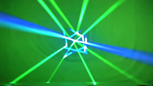 Abstract geometric shapes formed by intersecting blue and green laser beams on a textured green background