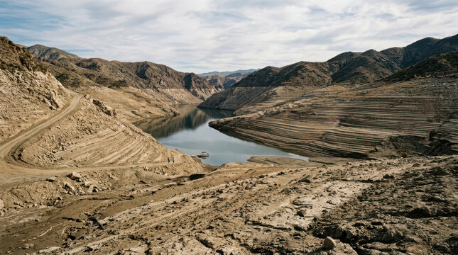 Wide High Angle View of Arid Mountain Reservoir During Drought Photo