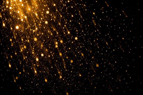 Golden light particles falling on dark background. Abstract glowing dust or rain effect. Festive texture for design, magic atmosphere, celebration concept and dark background overlay.