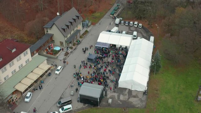 drone flying over small town skalnimlya near blasnko in czech republi cover some people n a concert going towards natural reserve moravain karst