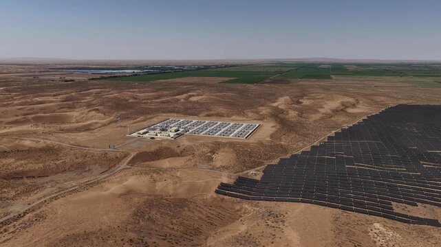 Aerial View of Utility-Scale Solar Farm with Battery Energy Storage System in Arid Desert