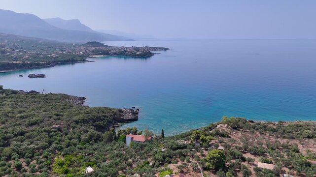 Aerial Flight toward Stoupa and Kalogria Beach along the Mountainous Coast of Mani, Messenia, Peloponnese, Greece
