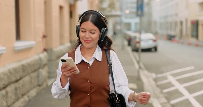 Headphones, dancing and businesswoman with phone in city for listening to music, radio or album. Happy, cellphone and corporate employee with audio tech for streaming playlist in town for commuting.