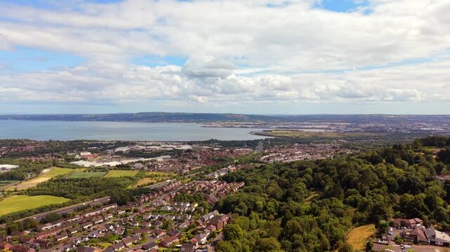 Wide 4K 60FPS aerial video of Belfast from Cavehill, Northern Ireland in the UK on a bright sunny day. Produced with Rec709 colour.