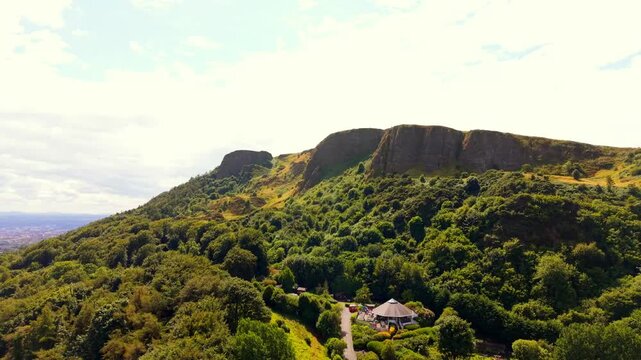 Clockwise 4K 60FPS aerial video of Cavehill in North Belfast, Northern Ireland in the UK on a bright sunny day. Produced with Rec709 colour.