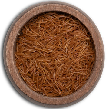 Top view of whole wheat vermicelli pasta in wooden bowl, isolated on transparent background