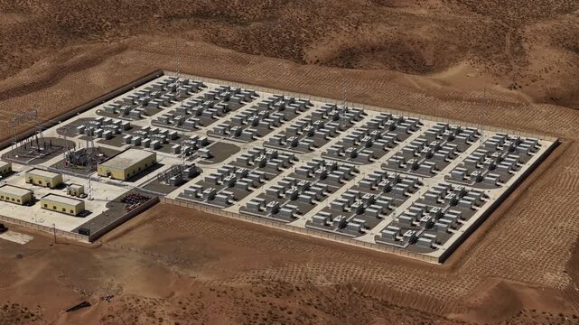 Aerial View of Utility-Scale Solar Farm with Battery Energy Storage System in Arid Desert
