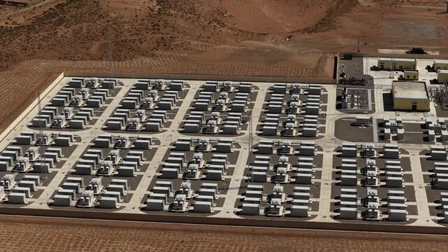 Aerial View of Utility-Scale Solar Farm with Battery Energy Storage System in Arid Desert