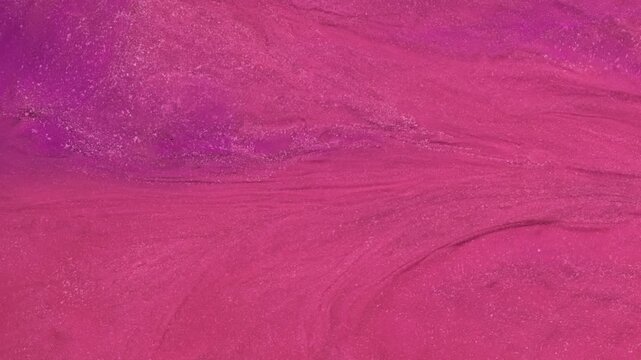 Mixing different colored alcohol inks to create abstract art patterns