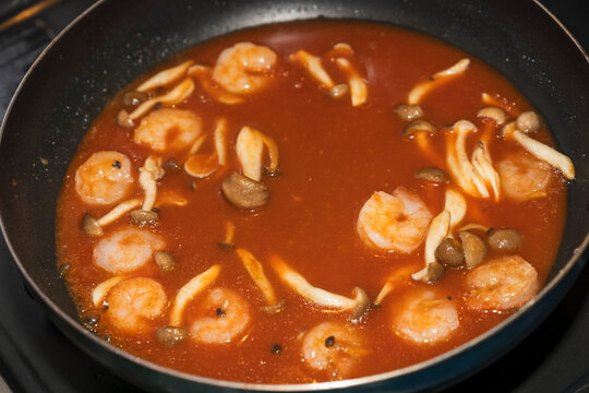 Shrimp and Mushrooms Simmering in Tomato Sauce