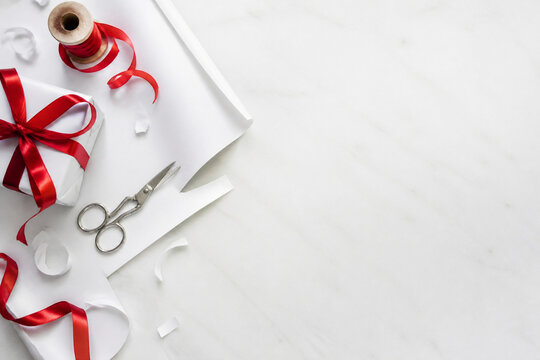 Overhead flat lay of gift wrapping in progress