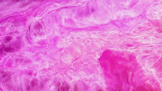 Mixing different colors of alcohol ink in a close-up view