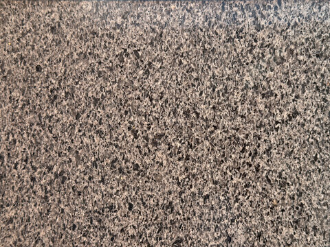 A clean, natural brown and black granite stone texture background, suitable for design, web usage, and creative projects.