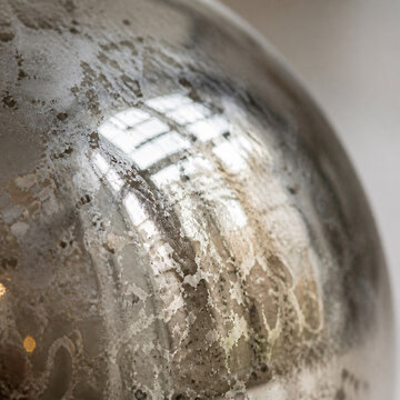 Extreme macro of the curved surface of a mercury glass ornament