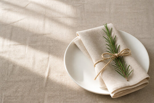 A single festive place setting on bare linen