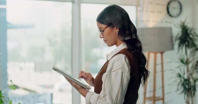 Woman, lawyer and reading in office with tablet, research and online evidence for court case. Thinking, person and attorney at law firm with tech, witness statement and legal records for proceedings