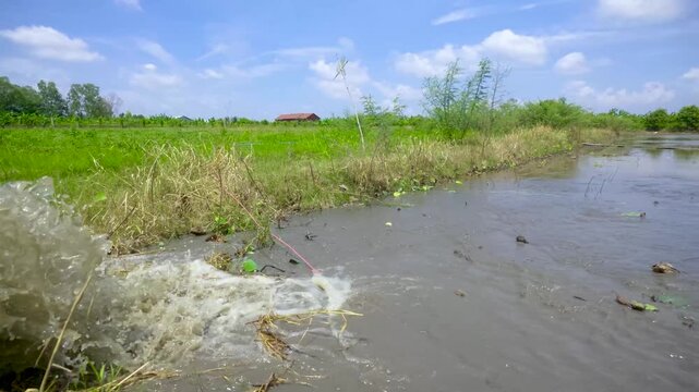 Water pump spraying into field