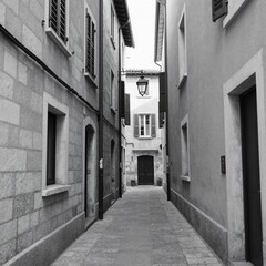 Fototapeta premium Narrow European alleyway with stone buildings and traditional shutters