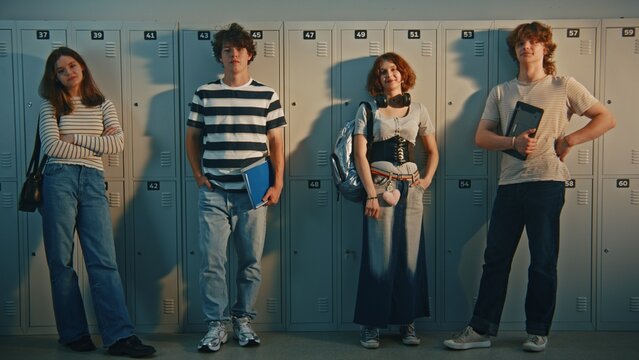 Portrait of Modern Gen Z High School Students Standing Together in Locker Room Corridor. Technology in Schools, Diverse Individual Styles, Everyday Student Routines in Modern Educational Settings.