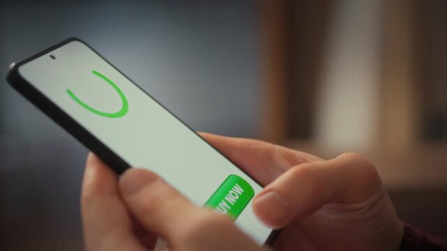Man taps pay button on his smartphone, awaiting payment confirmation. Seconds later the screen flashes successful purchase, showing online shopping and modern tech make transactions swift and easy