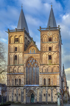 Historic facade of Xanten Cathedral stands in Xanten, Germany. Daylight with a partly cloudy sky